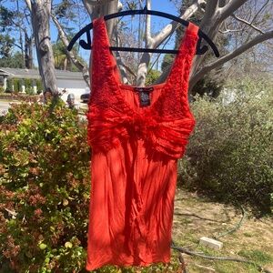 simply irresistible orange statement top